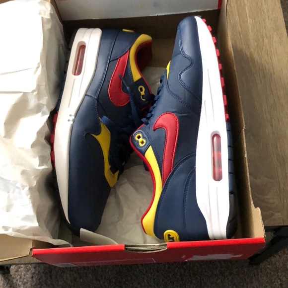 navy and red nike shoes